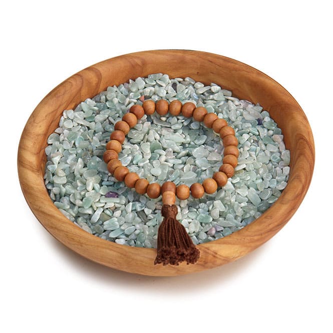 BRACCIALE di mala in LEGNO di SANDALO elasticizzato con nappina marrone
