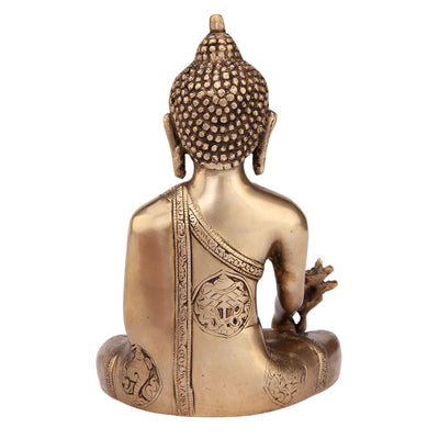 Statua in ottone dorato del 'Buddha della medicina' con incisioni sul dorso