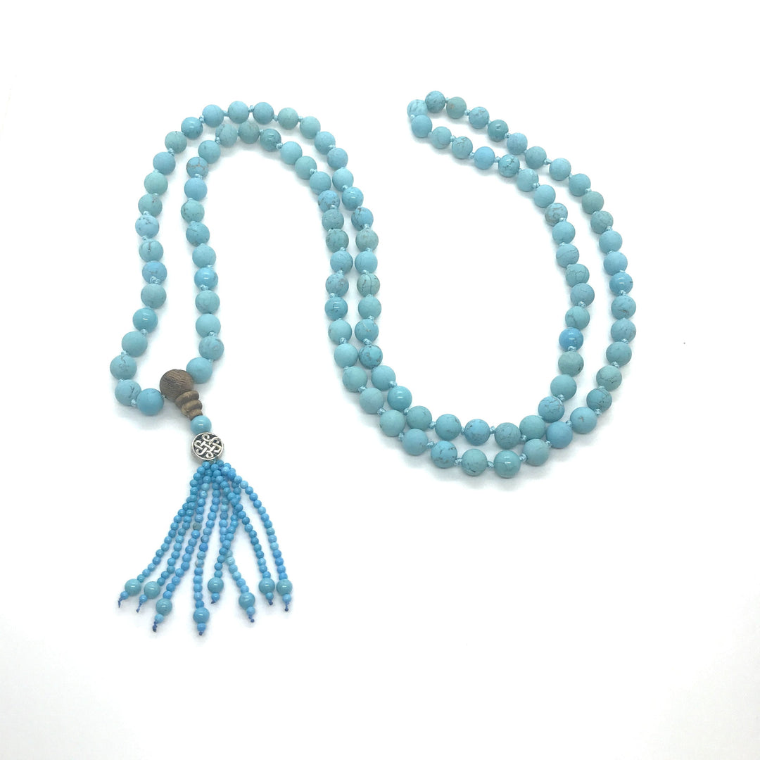 Mala in Howlite turchese con 108 perle e gurubead in legno e charme fiore della vita