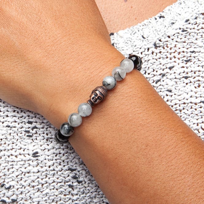 Bracciale in agata e quarzo rutilato, con testa di buddha bronzata, elegante e perline sfaccettate indossato